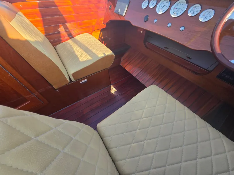 Slide: The Image of Interior of 2018 Cherubini Classic 24 with quilted seats and wooden dashboard. - 15