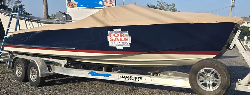 Slide: The Image of Cherubini Classic 24 boat, 2018 model, covered and for sale on a trailer. - 17