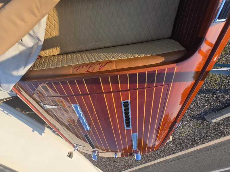 Slide: The Image of 2018 Cherubini Classic 24 boat with polished wood finish and quilted seating. - 20