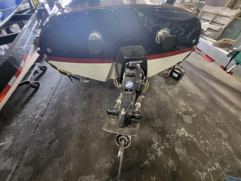 Slide: The Image of Rear view of a 2018 Cherubini Classic 24 boat with Mercury outboard motor. - 21