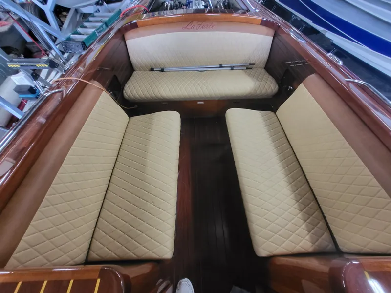 Slide: The Image of Engine compartment of a 2018 Cherubini Classic 24 with visible components and battery. - 26