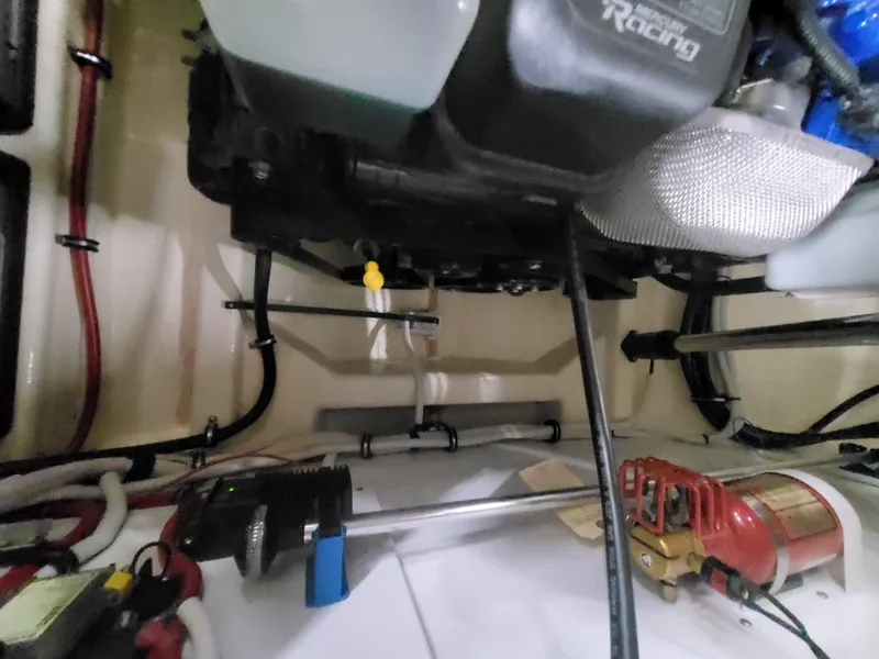 Slide: The Image of Engine compartment of a 2018 Cherubini Classic 24 boat, showcasing a polished engine. - 29