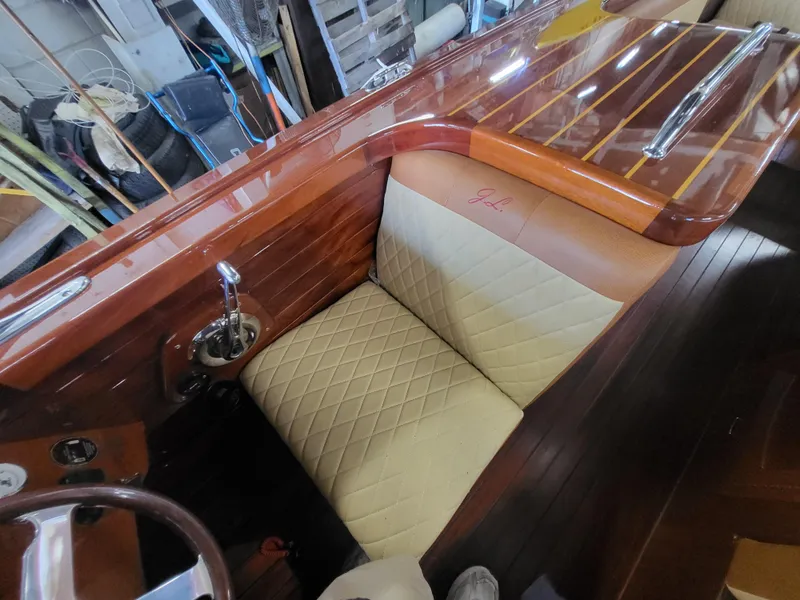 Slide: The Image of Luxurious 2018 Cherubini Classic 24 boat interior with elegant wood and beige seating. - 32