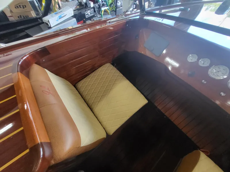 Slide: The Image of Interior of 2018 Cherubini Classic 24 boat, featuring a compact wooden cabin space. - 37