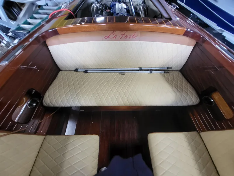 Slide: The Image of Interior of 2018 Cherubini Classic 24 with polished wood flooring and cushioned seating. - 42