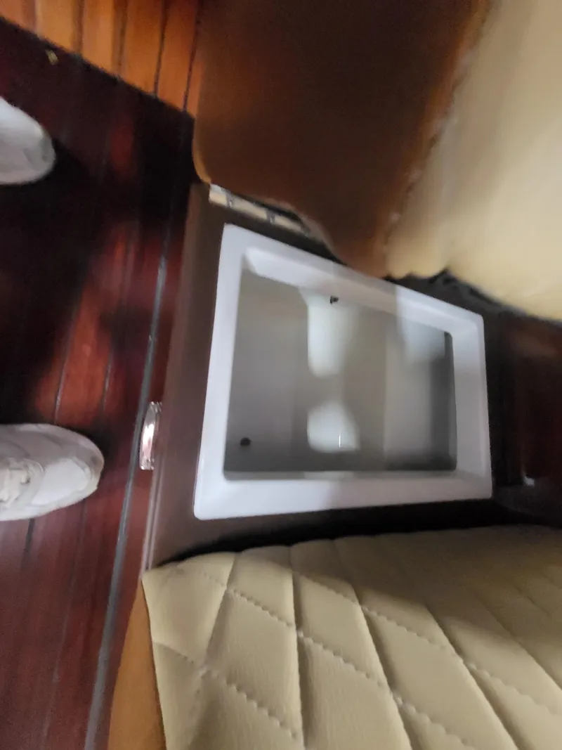 Slide: The Image of Interior of 2018 Cherubini Classic 24 with cushioned seating and built-in storage compartment. - 48