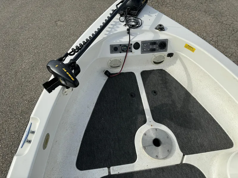 Slide: The Image of 2000 Yar-Craft 1785 Mille Lacs boat deck with trolling motor and carpeted flooring. - 13