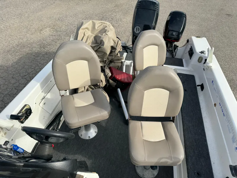 Slide: The Image of 2000 Yar-Craft 1785 Mille Lacs boat interior with beige seats and dual motors. - 15