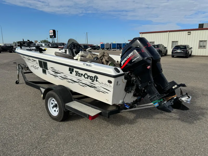 Slide: The Image of 2000 Yar-Craft 1785 Mille Lacs boat with Mercury outboard motor on trailer. - 4