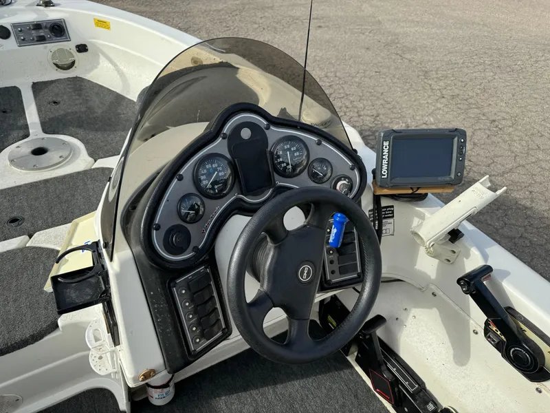 Slide: The Image of 2000 Yar-Craft 1785 Mille Lacs boat dashboard with steering wheel and navigation system. - 6