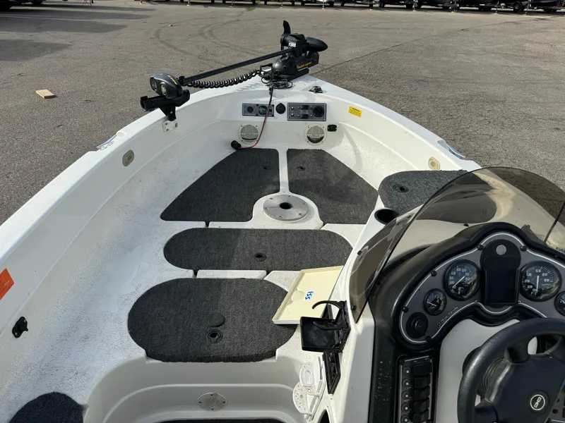 Slide: The Image of 2000 Yar-Craft 1785 Mille Lacs boat interior with steering console and trolling motor. - 8