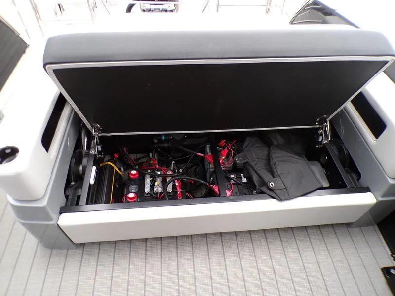 Slide: The Image of Open storage compartment in 2025 Godfrey Sanpan 2700 DFLW iMPACT PLUS pontoon boat. - 13