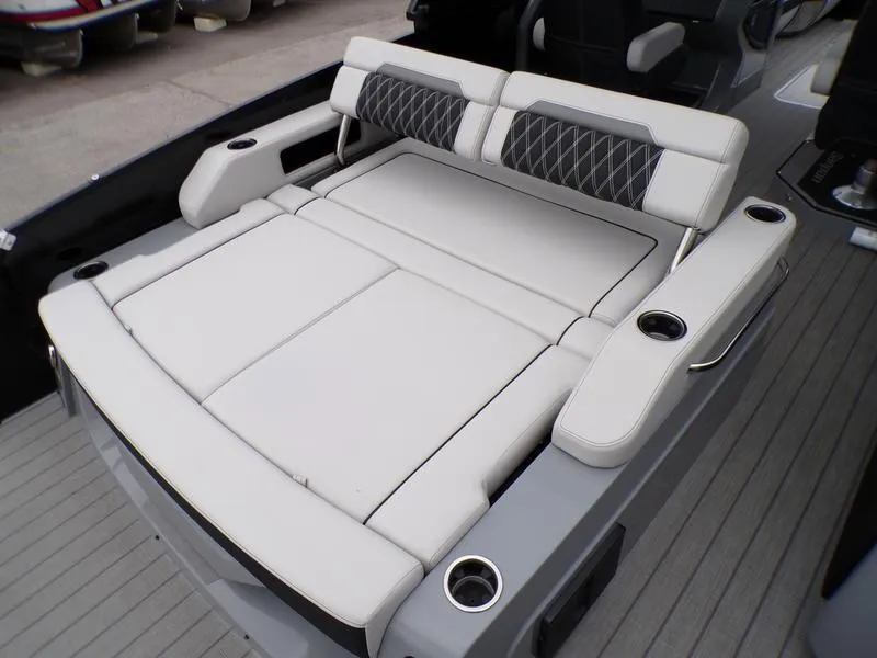 Slide: The Image of 2025 Godfrey Sanpan 2700 DFLW boat with luxurious seating and cup holders. - 14