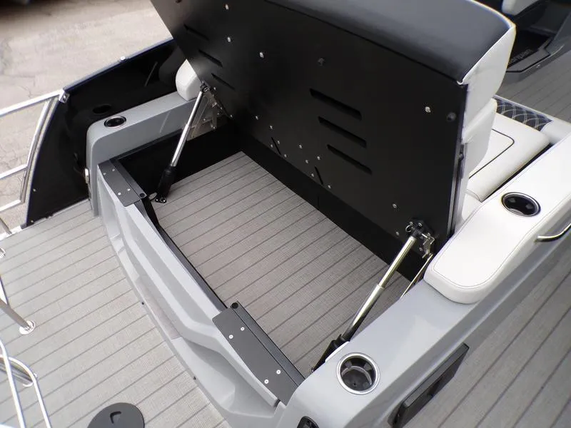 Slide: The Image of 2025 Godfrey Sanpan 2700 DFLW boat with open storage compartment and seating. - 16