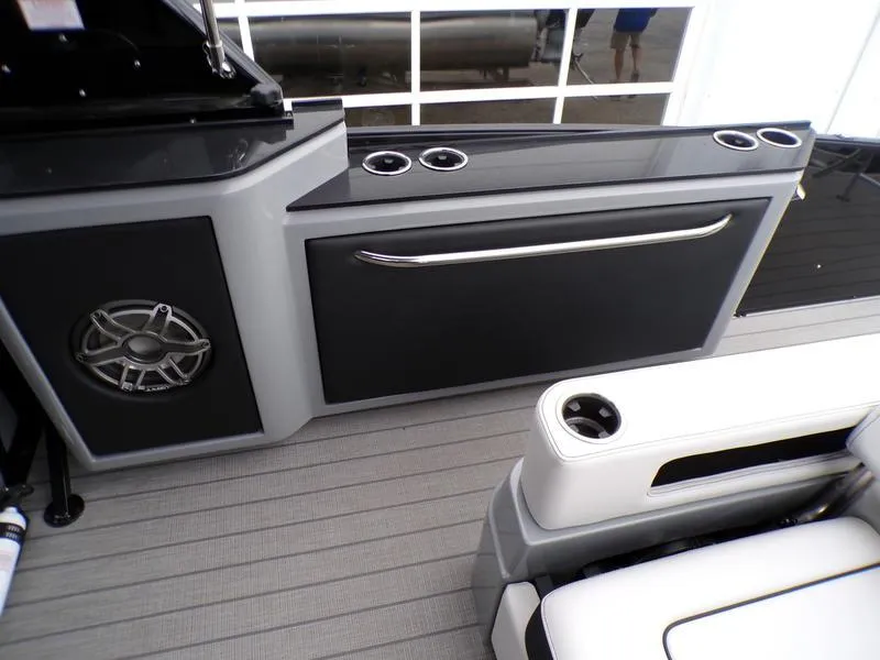 Slide: The Image of 2025 Godfrey Sanpan 2700 DFLW boat interior with sleek seating and modern console design. - 19