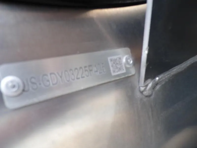 Slide: The Image of Close-up of a 2025 Godfrey Sanpan 2700 DFLW serial number plate. - 2