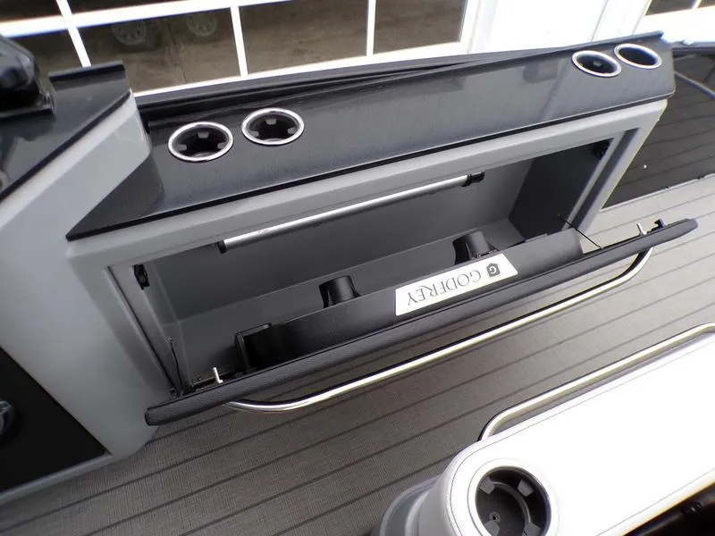Slide: The Image of 2025 Godfrey Sanpan 2700 DFLW iMPACT PLUS boat storage compartment with cup holders. - 20