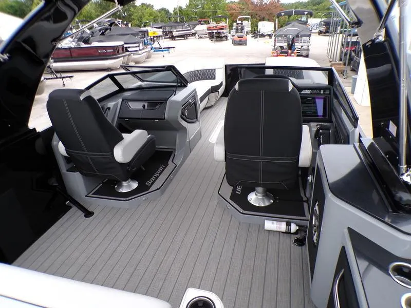 Slide: The Image of Interior of 2025 Godfrey Sanpan 2700 DFLW iMPACT PLUS pontoon boat, featuring modern seating and controls. - 21