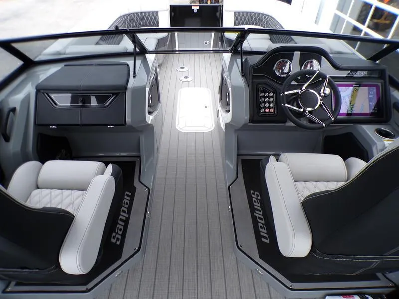 Slide: The Image of 2025 Godfrey Sanpan 2700 DFLW boat interior with modern dashboard and seating. - 23