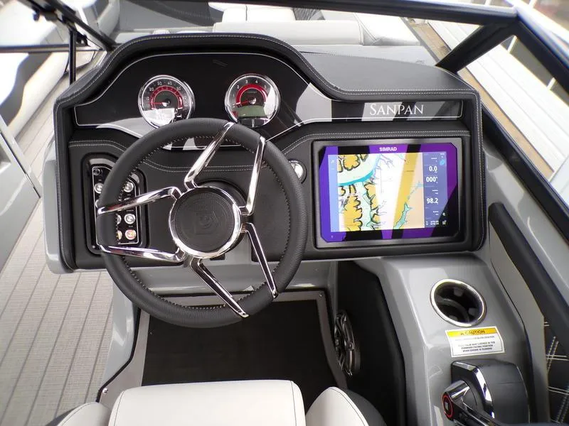 Slide: The Image of Godfrey Sanpan 2700 DFLW 2025 dashboard with navigation display and steering wheel. - 24