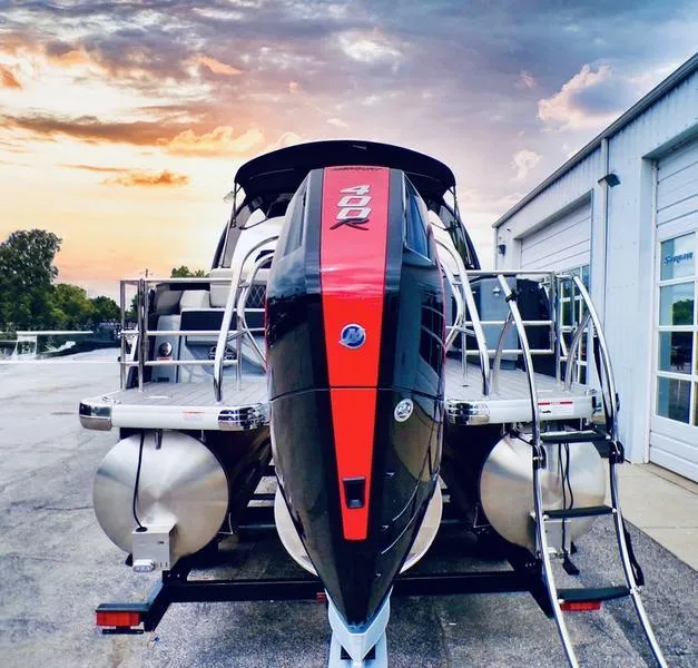 Slide: The Image of 2025 Godfrey Sanpan 2700 DFLW pontoon boat with iMPACT PLUS Package at sunset. - 8