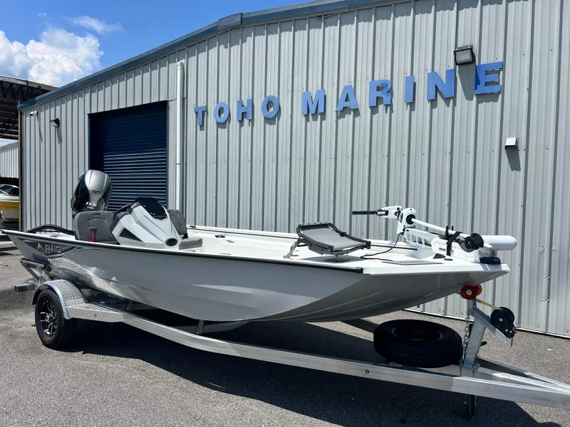 Slide: The Image of 2025 Avid 18SC Rouge boat on trailer at Toho Marine dealership. - 1