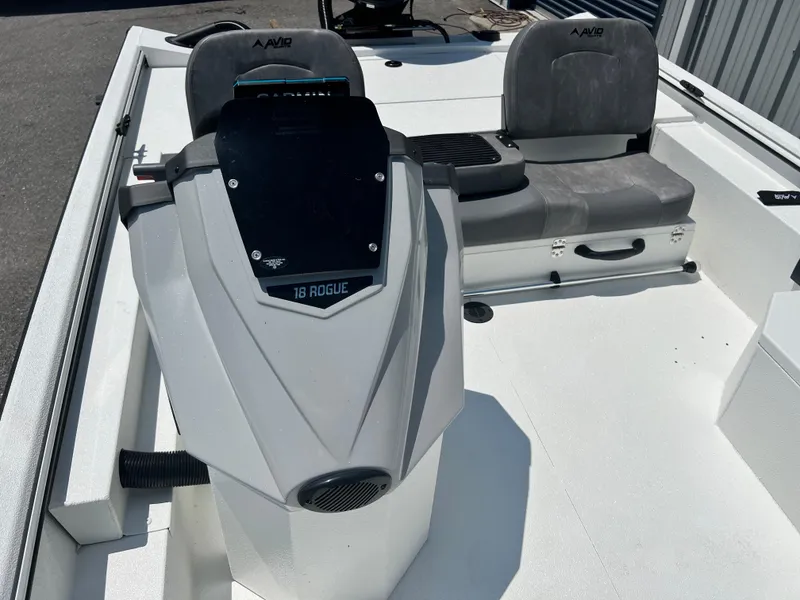 Slide: The Image of Avid 18SC Rouge 2025 boat interior with steering console and seating. - 11