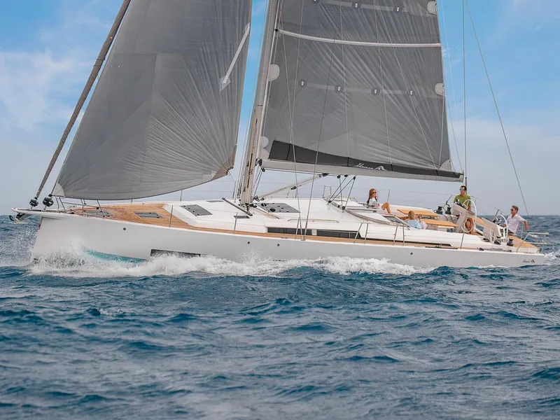 Slide: The Image of 2025 Hanse 510 yacht sailing on open sea with crew onboard. - 35