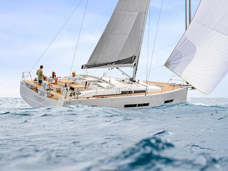 Slide: The Image of 2025 Hanse 510 sailboat navigating ocean waves under clear skies. - 40