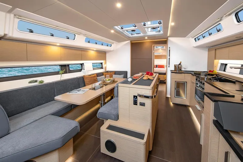 Slide: The Image of Luxurious interior of 2025 Hanse 510 yacht with modern kitchen and seating area. - 8