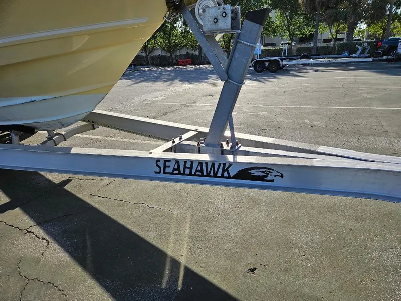 Slide: The Image of Tidewater 250 CC Adventure 2013 on Seahawk trailer in parking lot. - 11
