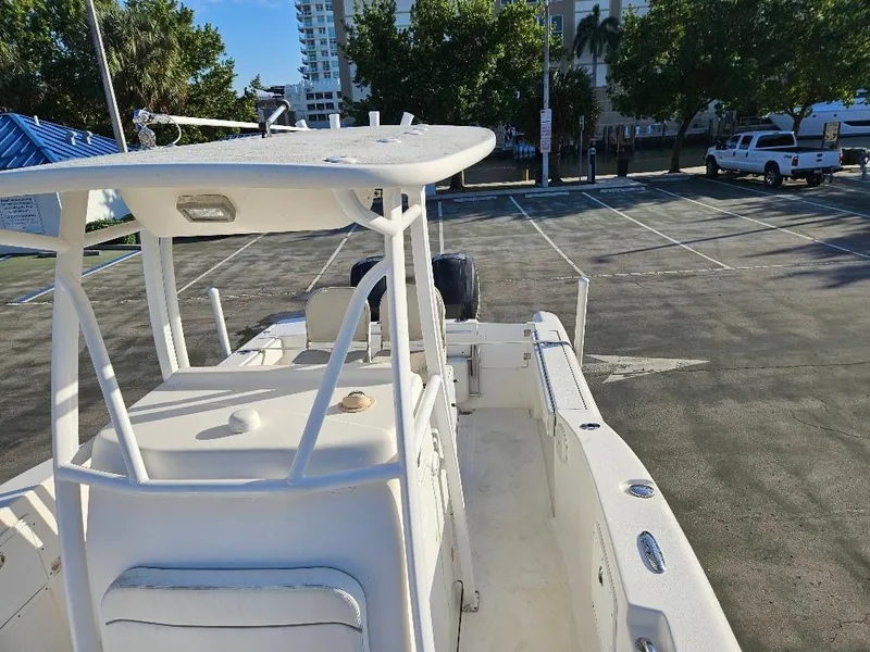 Slide: The Image of Tidewater 250 CC Adventure 2013 boat in parking lot, sunny day, urban background. - 14