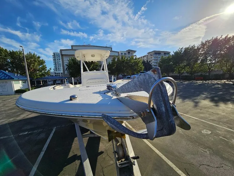 Slide: The Image of 2013 Tidewater 250 CC Adventure boat on trailer in sunny parking lot. - 20