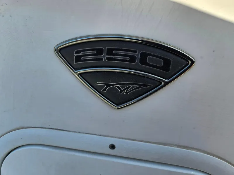 Slide: The Image of Tidewater 250 CC Adventure 2013 emblem on boat hull. - 25
