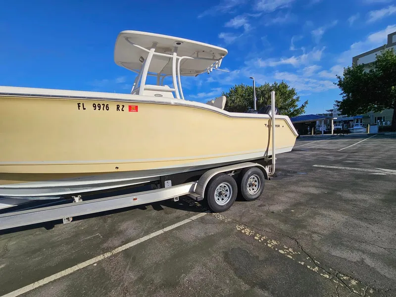 Slide: The Image of 2013 Tidewater 250 CC Adventure boat on trailer in parking lot. - 27