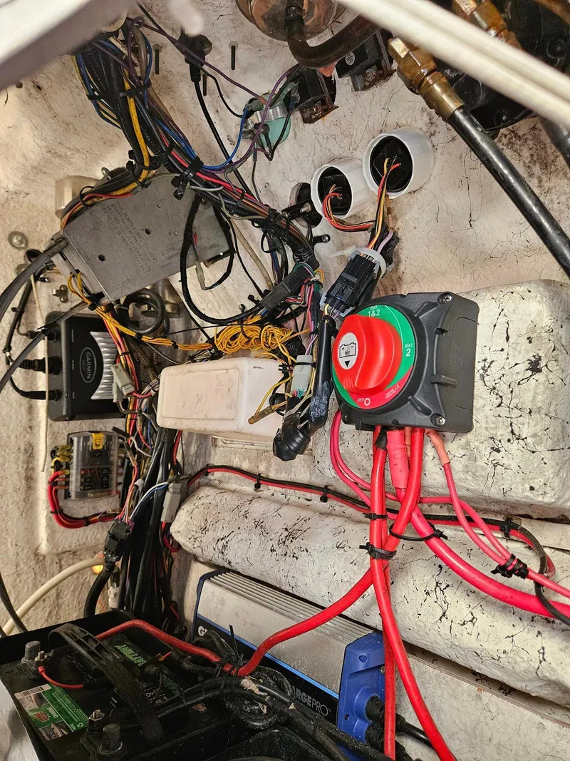 Slide: The Image of Electrical wiring and components inside a 2013 Tidewater 250 CC Adventure boat. - 34