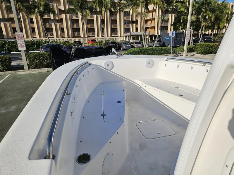 Slide: The Image of 2013 Tidewater 250 CC Adventure boat interior with spacious deck and seating. - 8