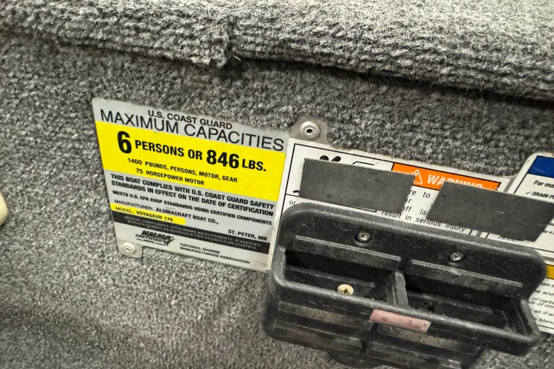 Slide: The Image of 2014 Alumacraft Voyageur 175 Tiller capacity label, 6 persons or 846 lbs, U.S. Coast Guard compliant. - 19