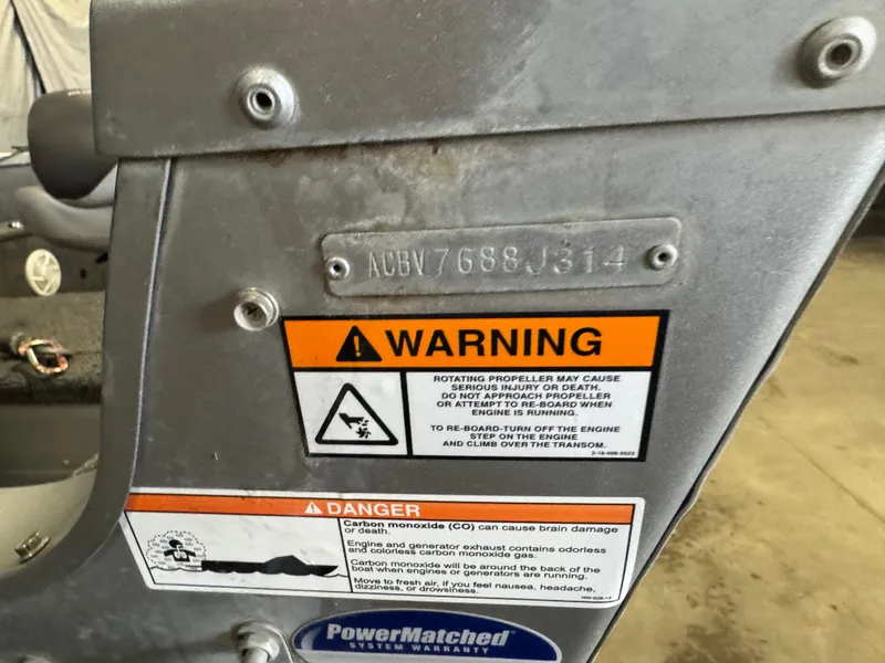 Slide: The Image of 2014 Alumacraft Voyageur 175 Tiller warning label with safety instructions and serial number. - 5
