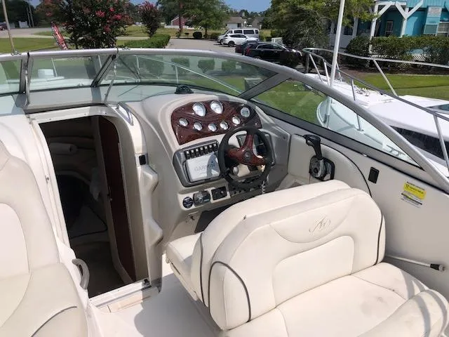 Slide: The Image of 2007 Monterey 250 Cruiser boat interior with steering wheel and dashboard controls. - 5