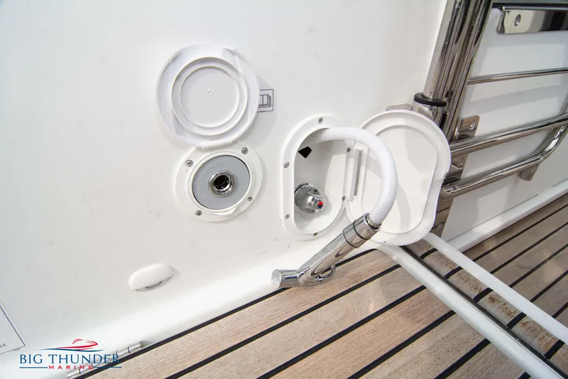 Slide: The Image of 2024 Jeanneau Leader 9.0 WA boat deck with hose and fittings. - 12