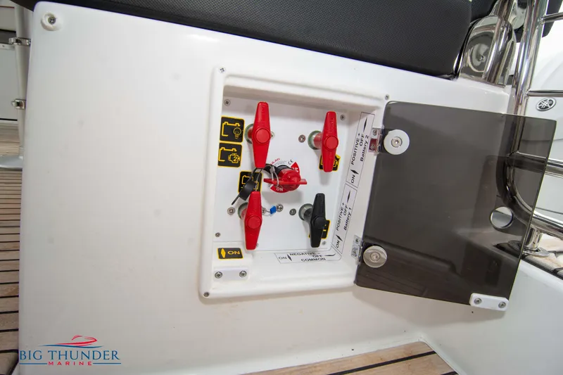 Slide: The Image of Control panel on 2024 Jeanneau Leader 9.0 WA boat with red switches. - 21