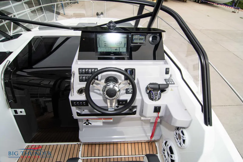 Slide: The Image of 2024 Jeanneau Leader 9.0 WA helm with modern controls and navigation display. - 26