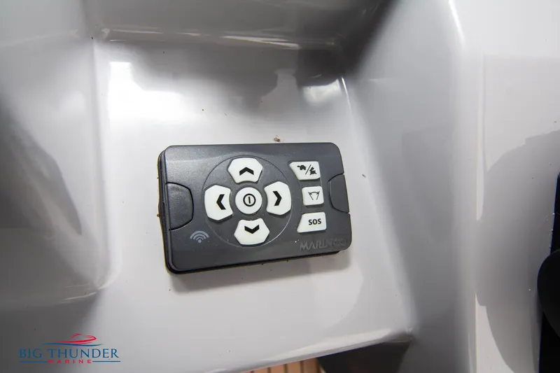 Slide: The Image of Remote control on Jeanneau Leader 9.0 WA 2024 boat dashboard. - 35