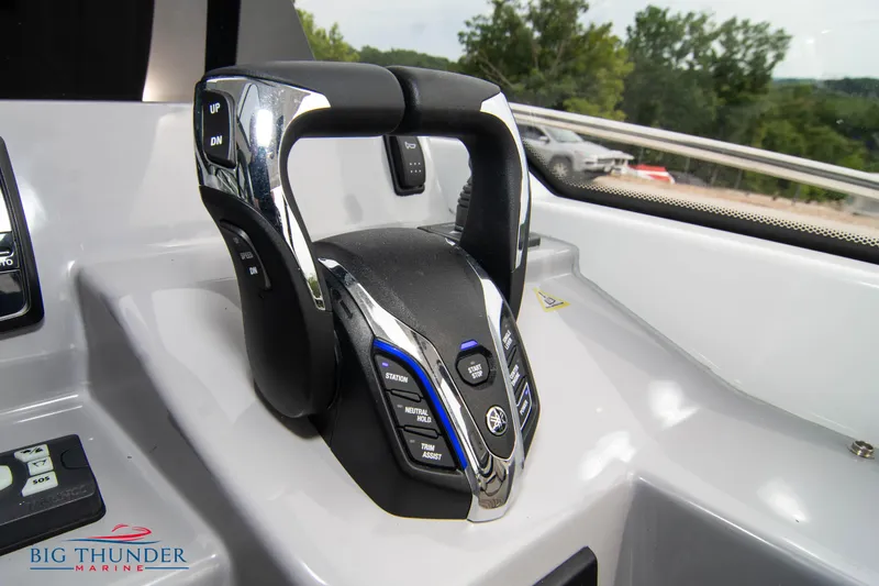 Slide: The Image of 2024 Jeanneau Leader 9.0 WA throttle controls in cockpit, featuring modern design and functionality. - 38