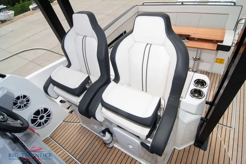 Slide: The Image of 2024 Jeanneau Leader 9.0 WA cockpit with dual seats and teak flooring. - 39