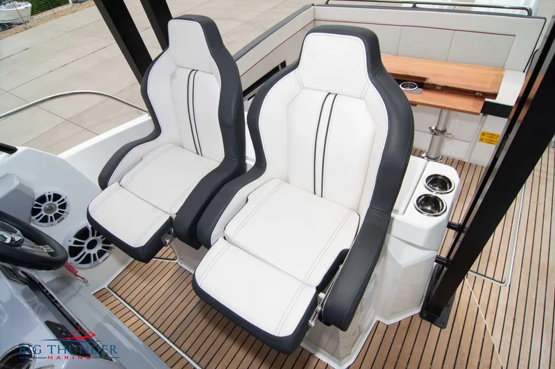 Slide: The Image of 2024 Jeanneau Leader 9.0 WA boat interior with white and black seating. - 40