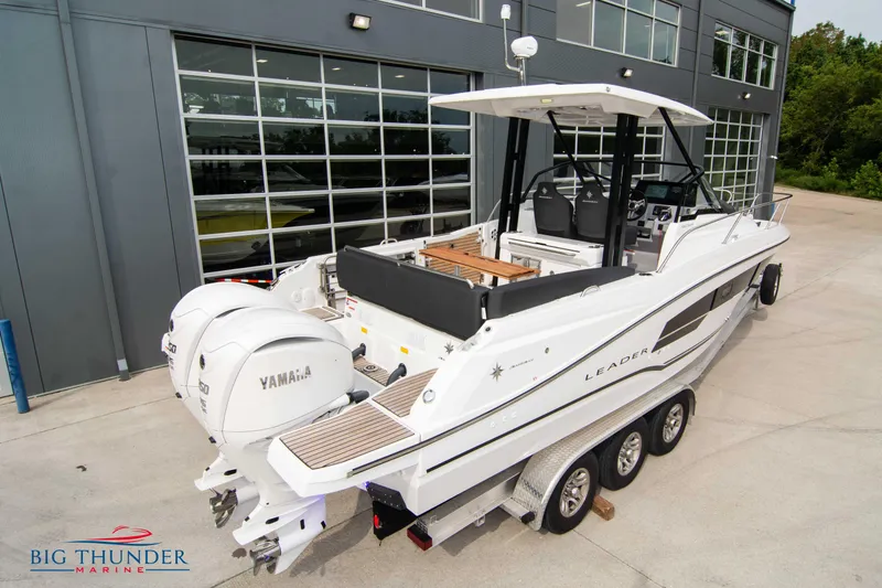Slide: The Image of 2024 Jeanneau Leader 9.0 WA boat with twin Yamaha engines on a trailer. - 5