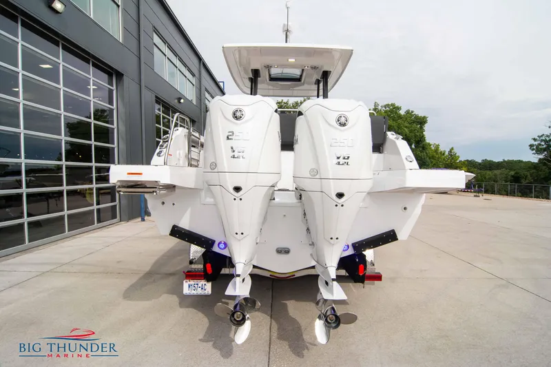 Slide: The Image of 2024 Jeanneau Leader 9.0 WA boat with dual engines at marina. - 6