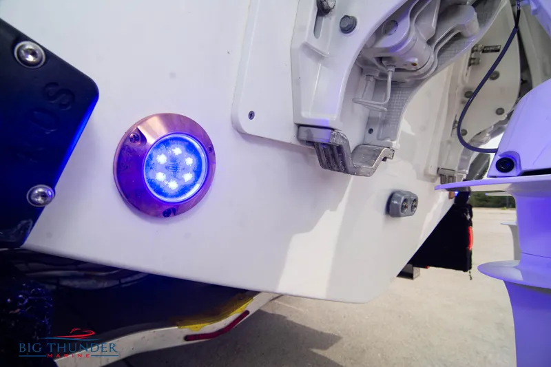 Slide: The Image of 2024 Jeanneau Leader 9.0 WA boat with blue LED light detail. - 8